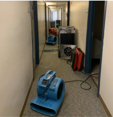 Students come back from class and have to step around the equipment filling the hallways. Photo: Jennie Maue